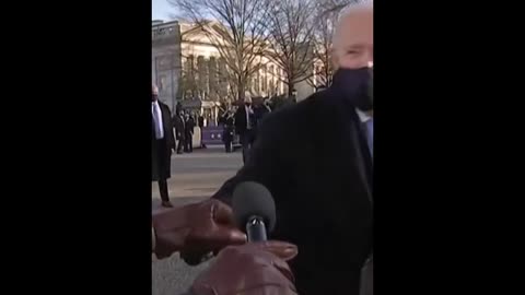 President Biden runs over to fist bump Al Roker during the virtual inaugural parade.