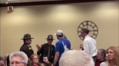 Salt Lake City arrested a man for wearing a patriotic shirt at a school board meeting.