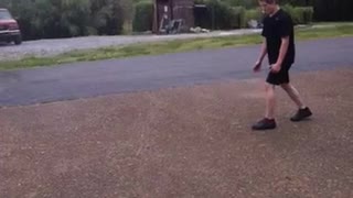 Black shirt kid tries to frontflip from pavement to grass