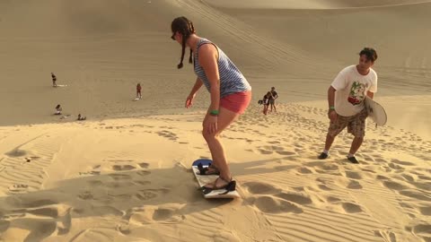 Sandboarding And Sand Sledding