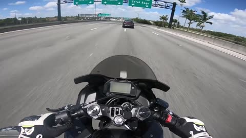 Police officer purposely slams on brakes for biker to crash into him on the highway 😳