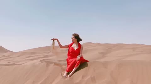 Red clad beauty in the desert