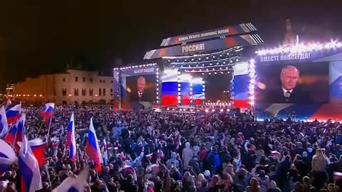 Crowd chants "Russia, Russia, Russia" in Moscow's Red Square as Putin makes an appearance.