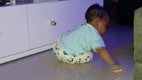 8 month old boy doing house chores