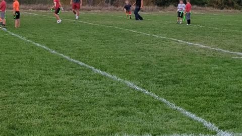 BradKuz76 Tommy "playing" flag football with Parker 2023
