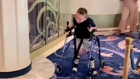 Boy With Cerebral Palsy Heroically Walks To Mickey Mouse