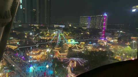 Looking down on the night view under the Ferris wheel