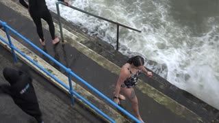 Swimmers on the Hoe Ocean City. New Years Day 2023