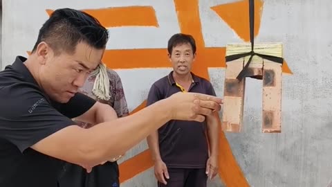 Impressive kung fu skills. Breaking bricks with energy - qi