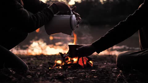 People pouring a warm drink