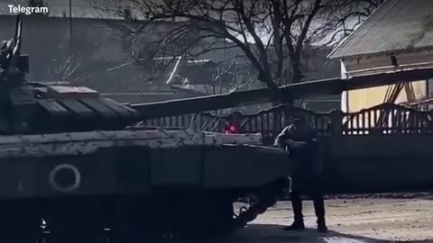 Brave man tries to stop a Russian tank with his bare hands