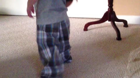 Toddler walking with box over head results in expected ending