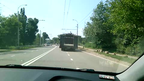 Semi Truck Transporting a Tank Flips Off the Road