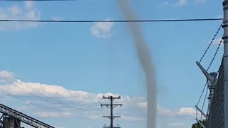 Dust Devil Reaches High Into Sky