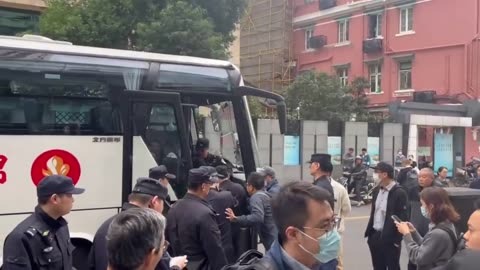 CCP police bus takes away protesting residents