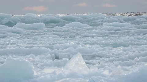 Waves of ice cover frozen surface of Lake Superior