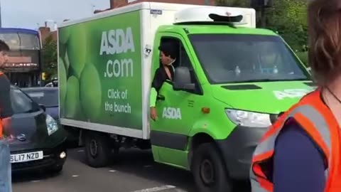 Radical environmental activists block a mother from taking her baby to the hospital.