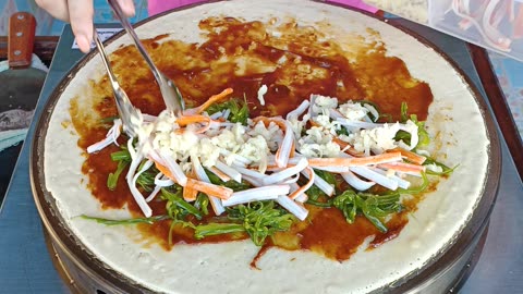 Bold Thai Crêpe Fusion: Tomato Ketchup, Mayo, Chili Paste, Seaweed, Crab Sticks & Cheese Sensation!