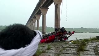 At least 12 killed in India after bus falls into river