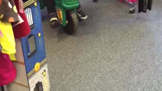 2 year old tries to steal thrift store tractor and makes a getaway