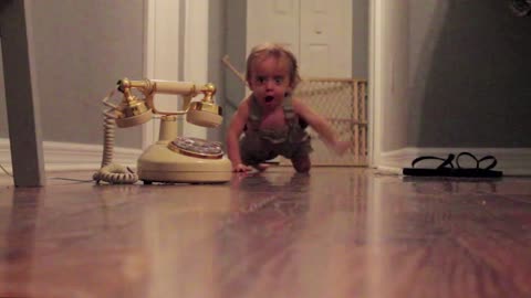 Baby Charges Through Hall To Answer Phone