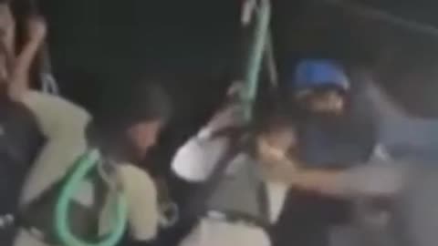 This latest footage shows two children being winched to safety after they were rescued