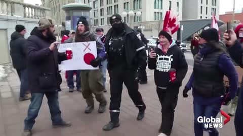 Demonstrators confront Ottawa police as they hand out citations