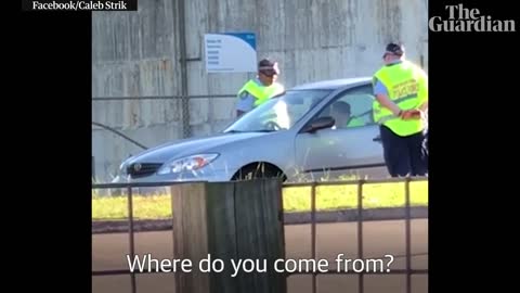 Sydney police officer appears to shove driver and use racist language