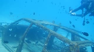 remains of an old car at the bottom of the ocean