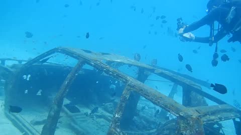 remains of an old car at the bottom of the ocean