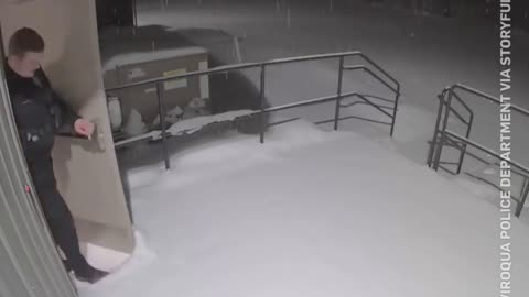 Funny moment a pile of snow drops on top of a Wisconsin officer