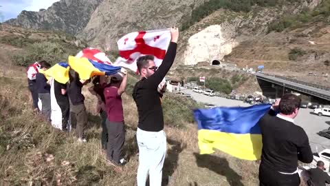 Georgians protest Russians fleeing across the border