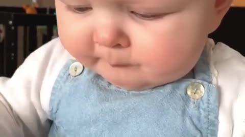 Try not to laugh - baby eating lemon for the first time