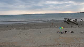 Drone footage panning away from the sea. SEP 2022