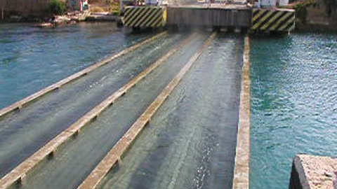 Greece - Bridge that lowers into the water to allow boats to pass through