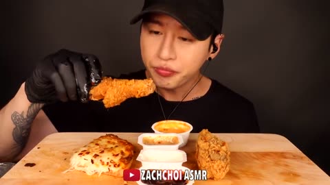 Show eating pizza and KFC chicken and lots of cheese