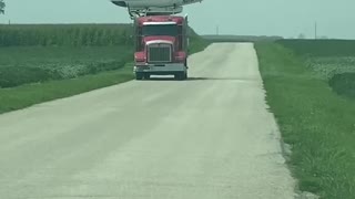 Helicopter Lands on Semi