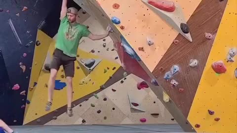 A kid running in the bouldering area and getting kicked