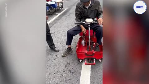 Elderly innovator creatively rigs suitcase into mobility scooter