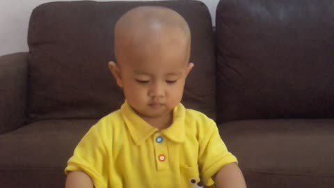 cute baby learning how to playing puzzle at home