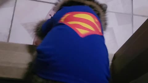 After the walk, the raccoon with superman suit jumps like an arrow and goes up to wash his hands