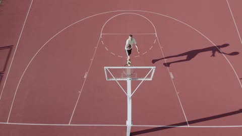 A Droneshot of Someone Playing Basketball