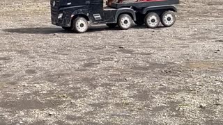 Boy Hauls His Best Friend With His Toy Truck