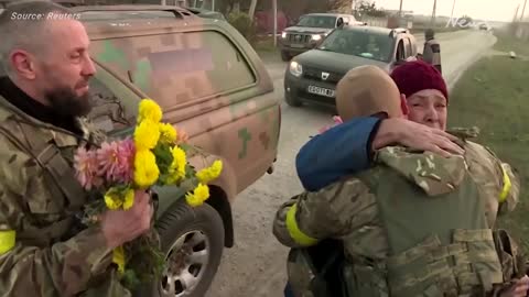 Villagers greet Ukrainian soldiers with flowers