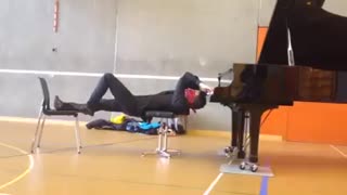 Playing the piano upside down and blindfolded!