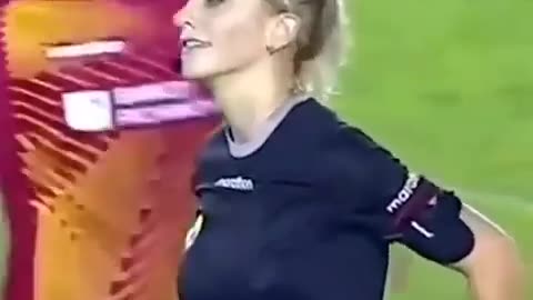 The female soccer referee made eye contact with the player. Pretty funny.