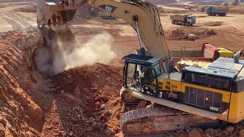 Caterpillar 365C Excavator Loading Trucks