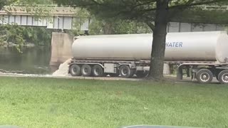 Watch is this truck dumps ‘something’ into the Grand River, in Grand Rapids Michigan?