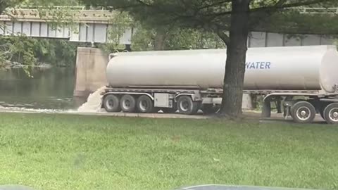 Watch is this truck dumps ‘something’ into the Grand River, in Grand Rapids Michigan?