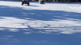 Husky Joins Daughter for ATV Pulled Sled Ride